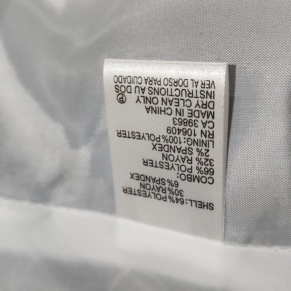 Classic black Tahari blazer with white trim, zipper pockets and sleeves. - Picture 12 of 12